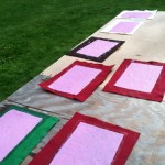 sheets of handmade paper drying in the sun