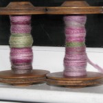 two bobbins of handspun singles ready to be plied into yarn