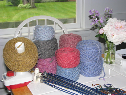 cakes of wool yarn wound on a ball winder