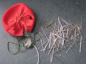 empty old pincushion and needles