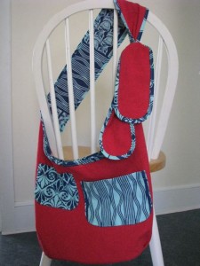 reversible slouch bag in turquoise and red