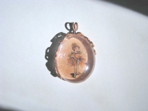 glass pebble and copper wire pendant