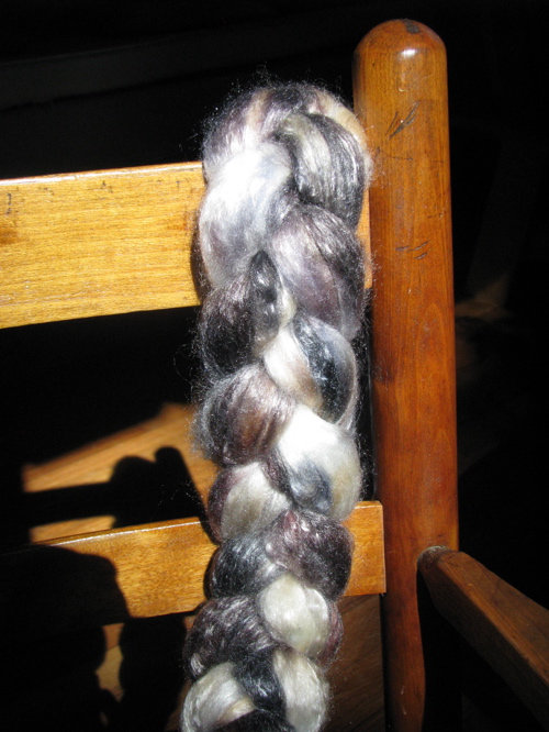wool roving hung on child's wooden rocking chair