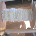 spinning bfl (blue faced Leicester) on my Baynes spinning wheel